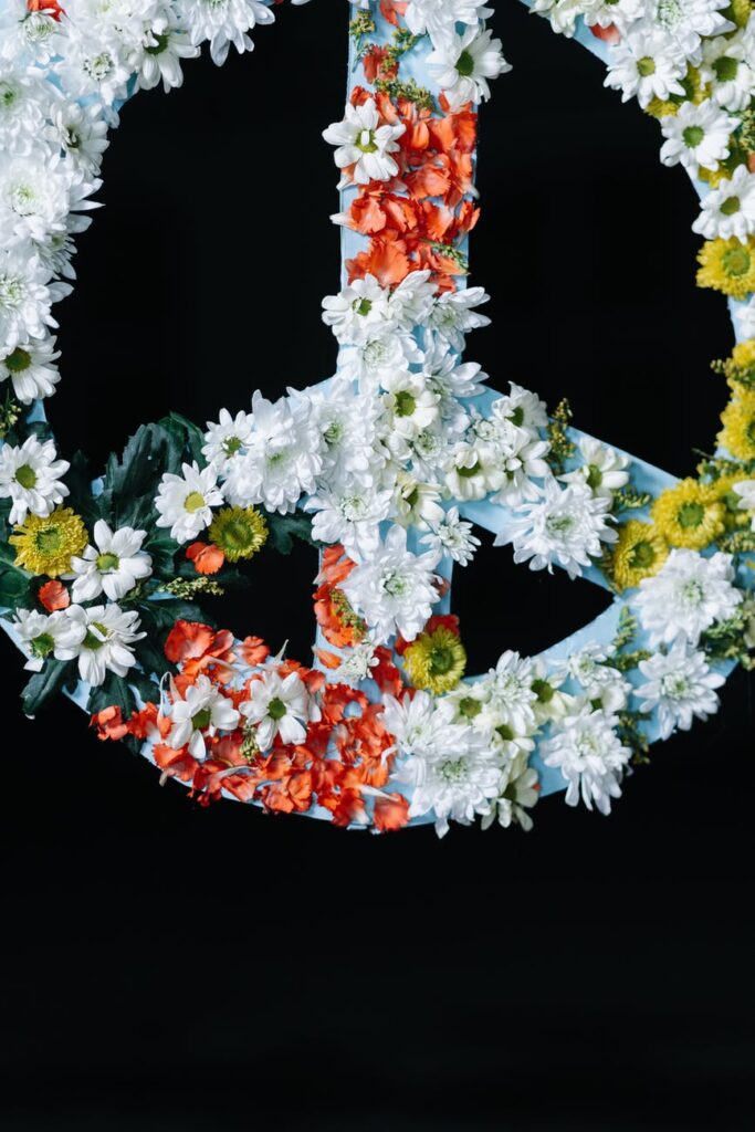 peace sign banner covered in flowers