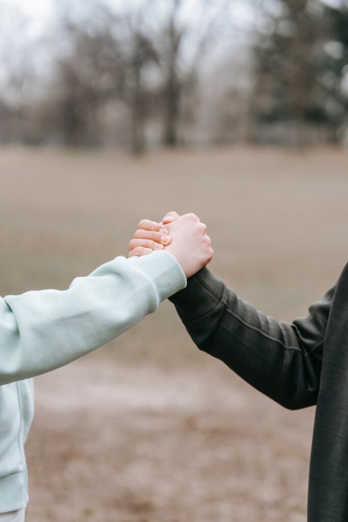 people in park supporting each other